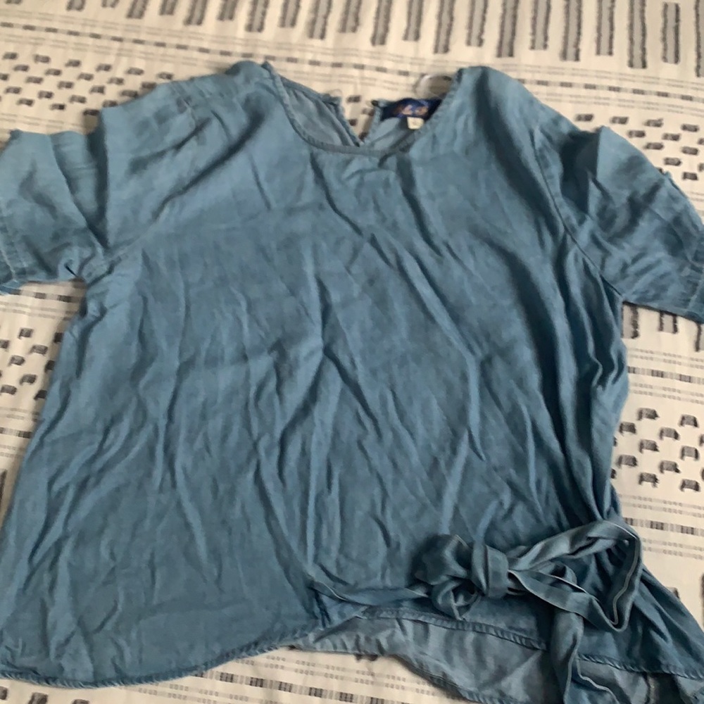 Denim shirt with tie in bottom right corner